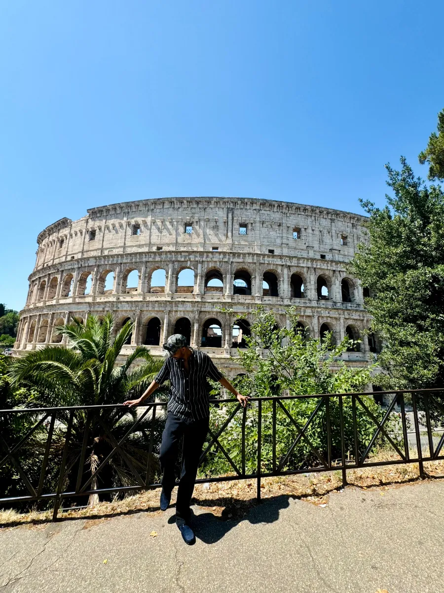 Kavindu Ravishan Perera in front of the Colosseum in Rome on a clear day